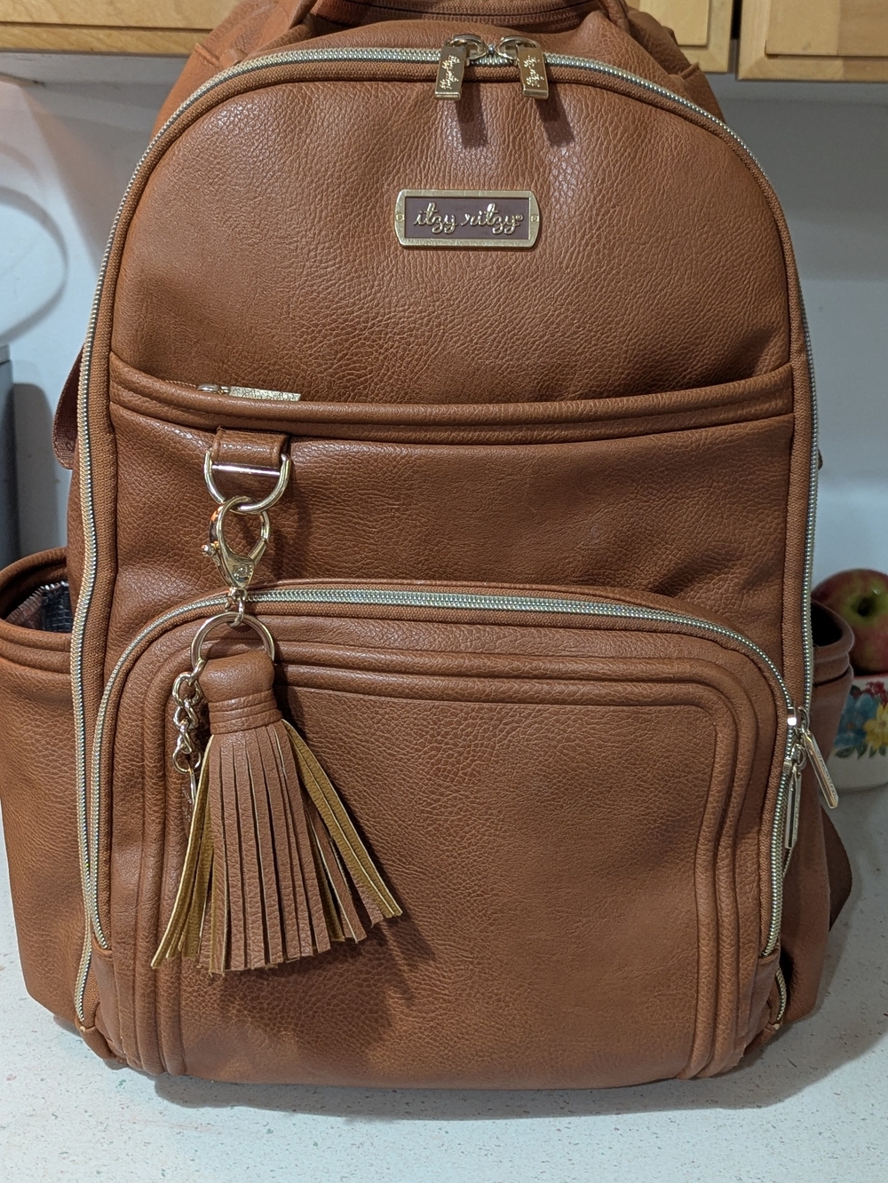 Itzy Ritzy Brown Faux Leather Backpack with Tassel Charm